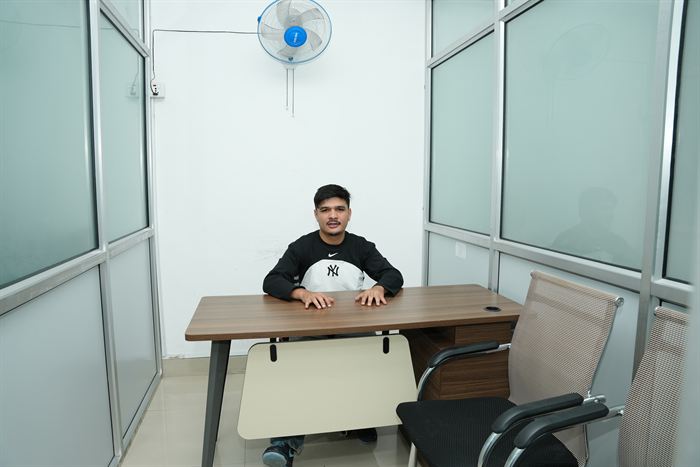 A member seated at the desk in the Fewa private cabin at Stratex