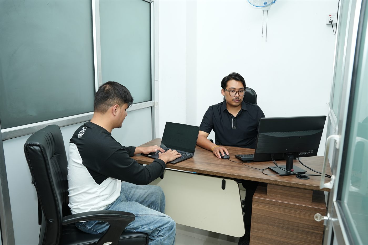 Two members working side by side in the Rara private cabin at Stratex
